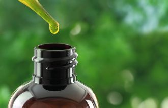 Dropper over essential oil bottle